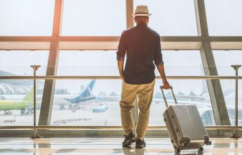 A man traveller at the airport.